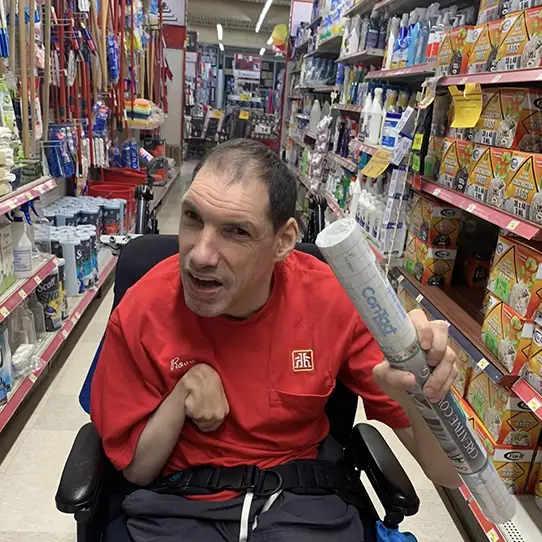 man in wheelchair shopping at a store