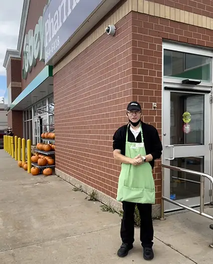 man standing in front of Sobeys store